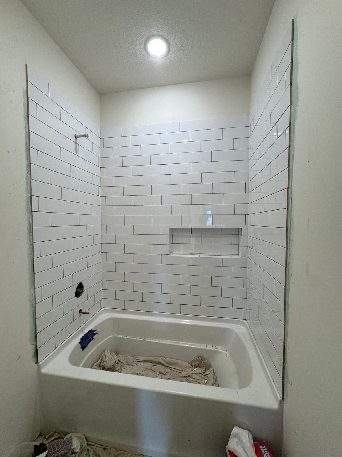 Project Sleek Subway Tile Installation in Bathroom Remodel image